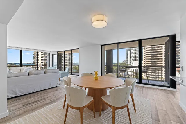 a view of a dining room with furniture and window