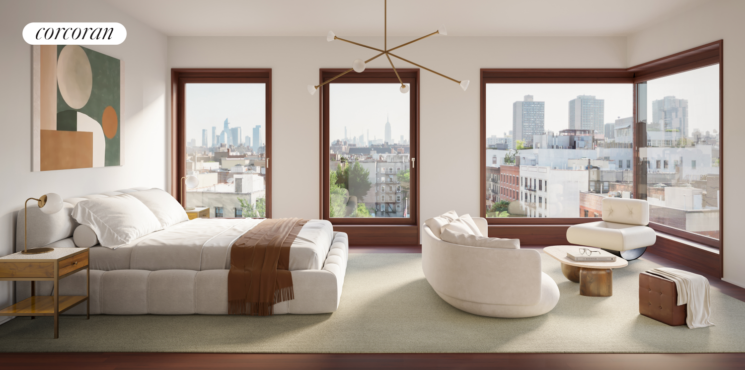 83 Thompson Street, Unit PH Manhattan, NY 10012 - Photo 6 of 20 a living room with furniture and a large window
