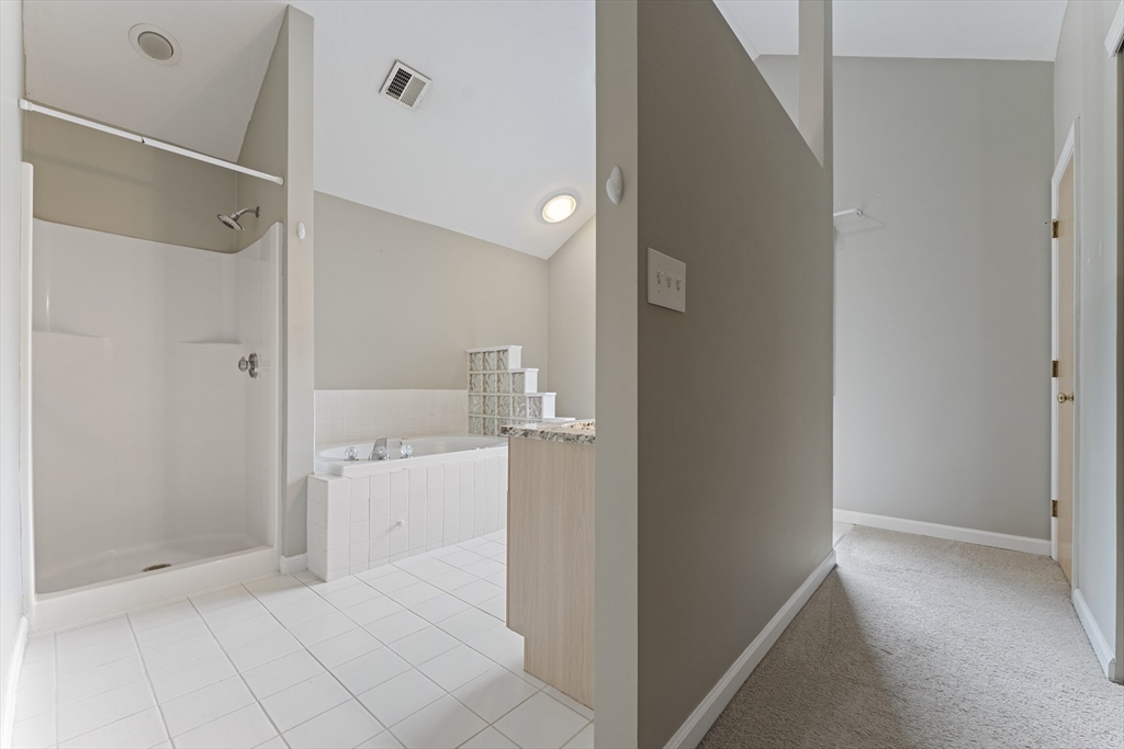 22 Arrowhead Circle, Unit 22 Ashland, MA 01721 - Photo 20 of 35 a bathroom with a shower and a sink