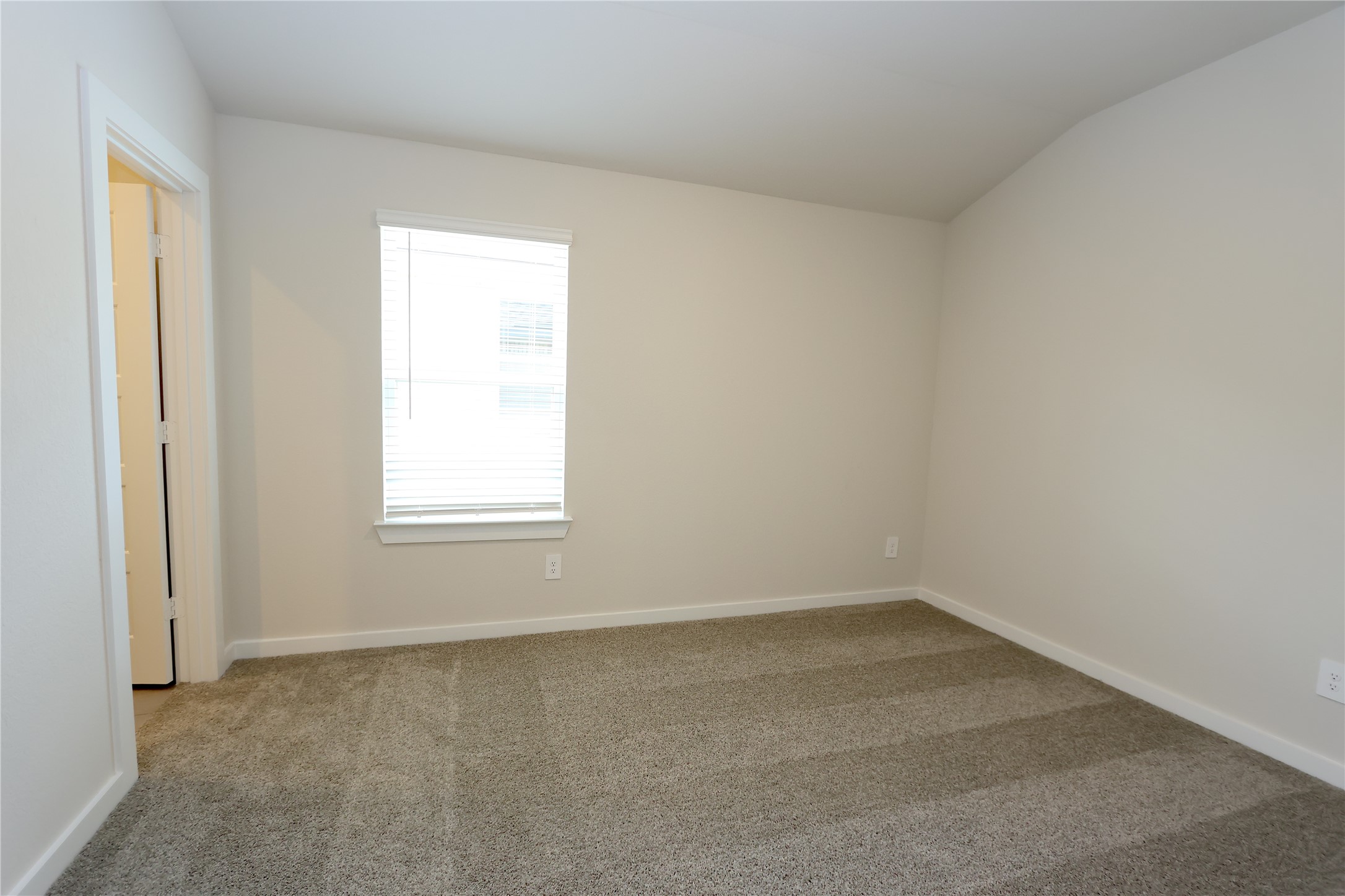 1480 Waggoner Rnch Trail Conroe, TX 77301 - Photo 15 of 18 an empty room with a window