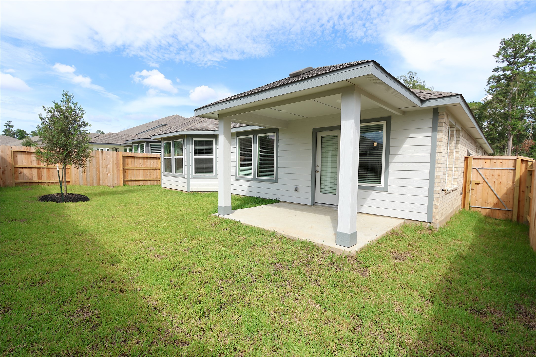 1480 Waggoner Rnch Trail Conroe, TX 77301 - Photo 18 of 18 a view of a house with a yard