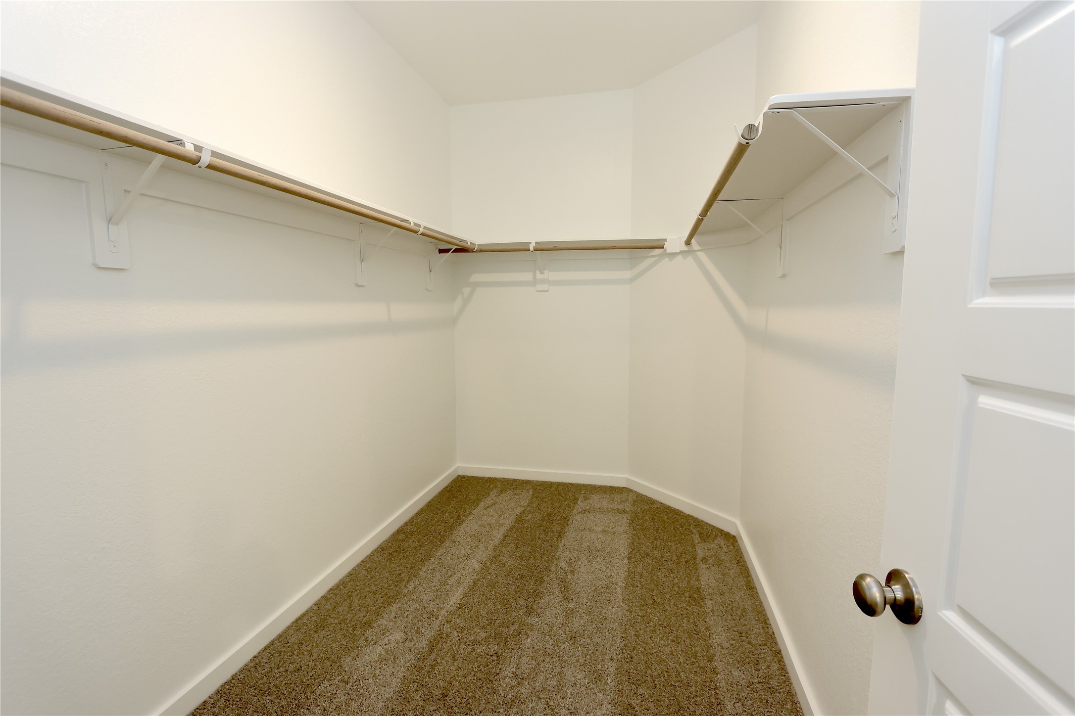 1480 Waggoner Rnch Trail Conroe, TX 77301 - Photo 6 of 18 a view of a room with racks on the wall