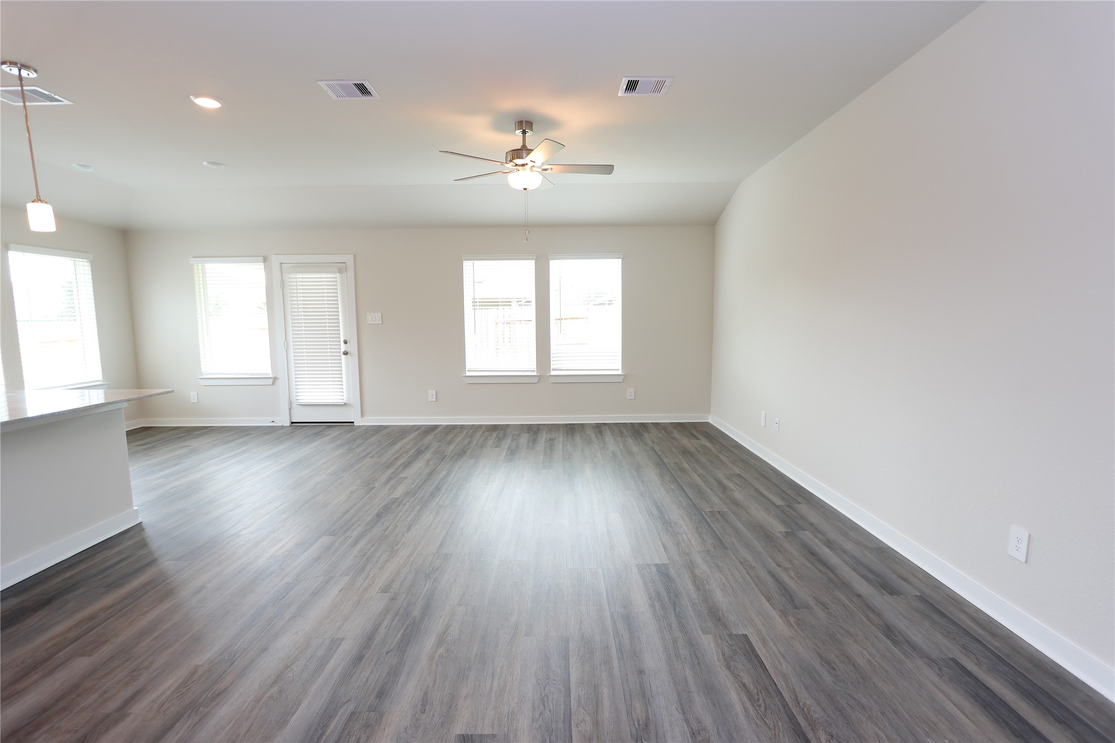 1480 Waggoner Rnch Trail Conroe, TX 77301 - Photo 10 of 18 an empty room with wooden floor and windows