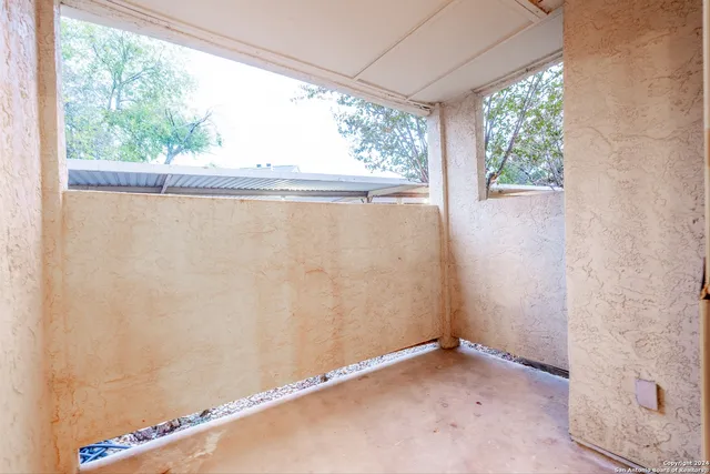 a view of a room with a large window