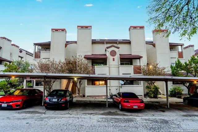 a view of a bathroom with a sink and a shower
