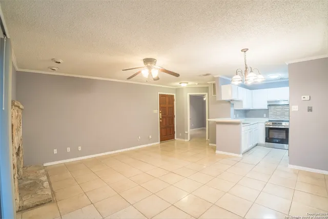 a view of a kitchen with a sink and cabinets