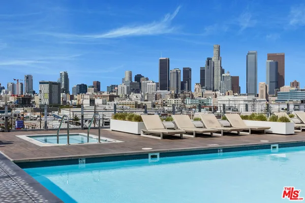 a view of a swimming pool with outdoor seating