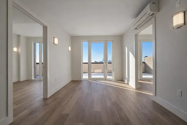 a view of a livingroom with wooden floor