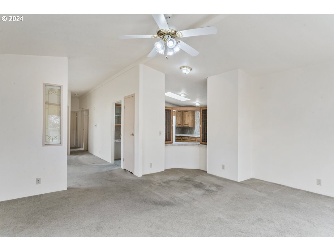 2150 Laura Street, Unit 212 Springfield, OR 97477 - Photo 11 of 37 a view of a livingroom with a chandelier fan