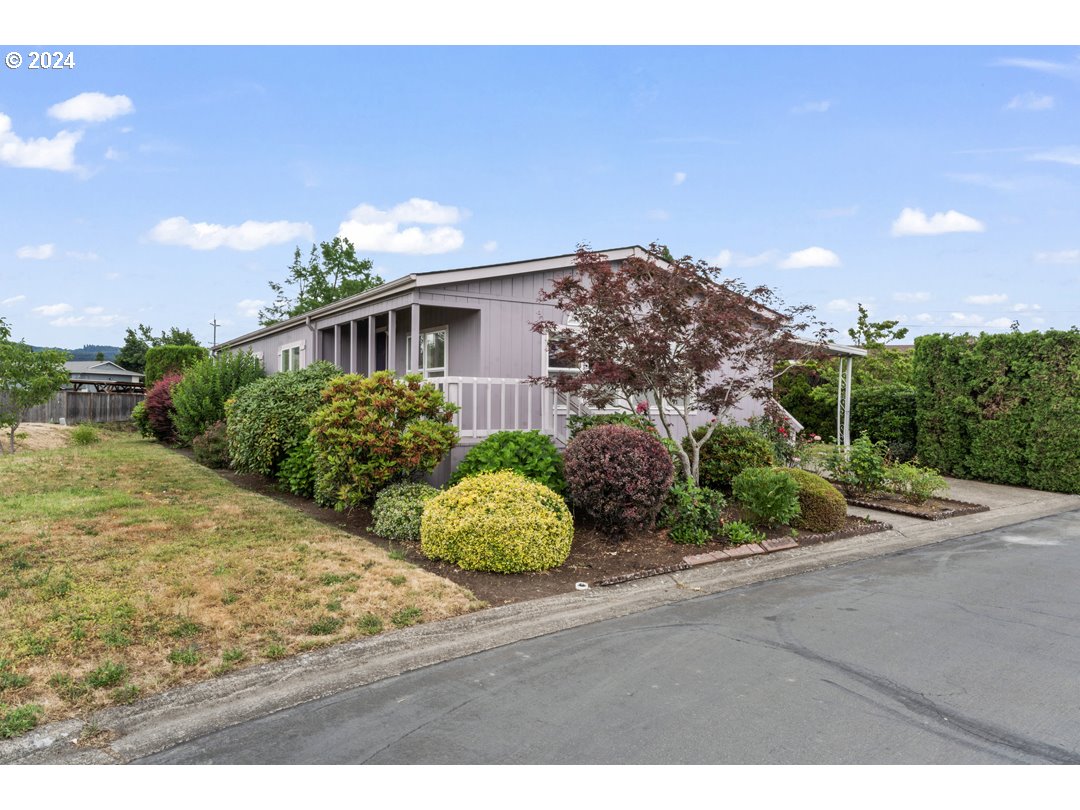 2150 Laura Street, Unit 212 Springfield, OR 97477 - Photo 27 of 37 a front view of a house with garden