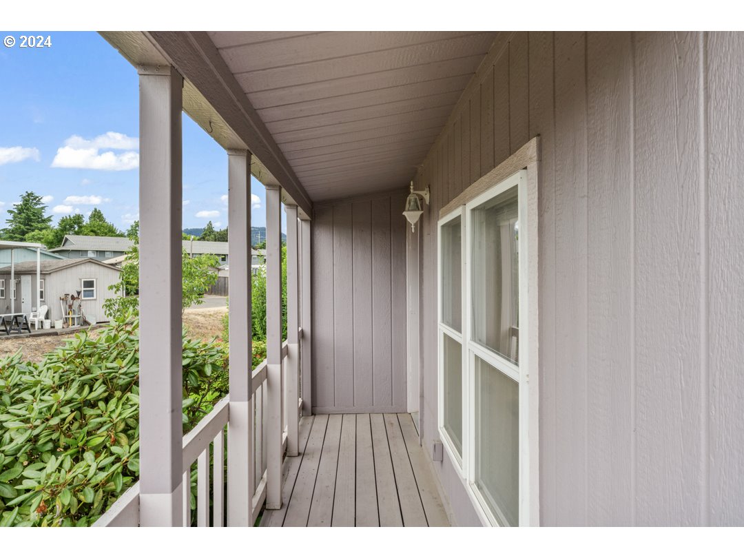 2150 Laura Street, Unit 212 Springfield, OR 97477 - Photo 31 of 37 a view of balcony with wooden floor