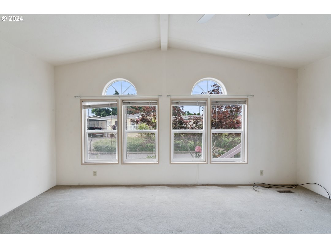 2150 Laura Street, Unit 212 Springfield, OR 97477 - Photo 6 of 37 a view of an empty room with a window