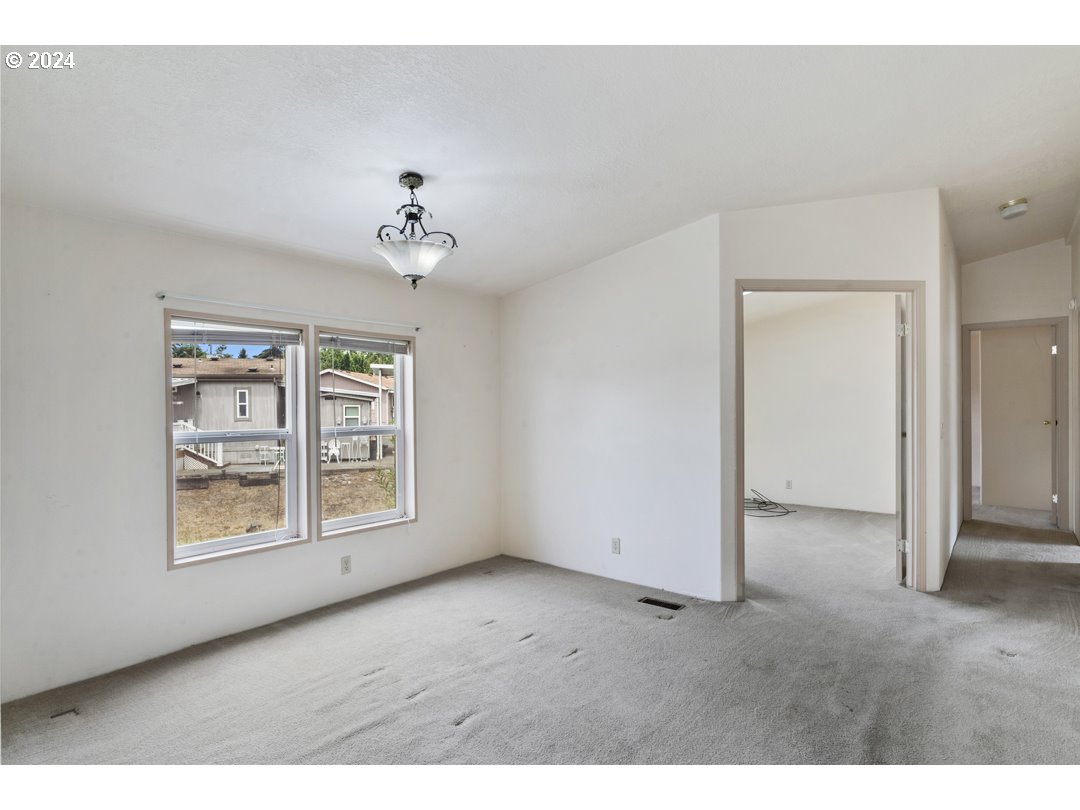 2150 Laura Street, Unit 212 Springfield, OR 97477 - Photo 9 of 37 a view of an empty room with a window
