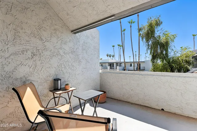 a view of balcony with furniture