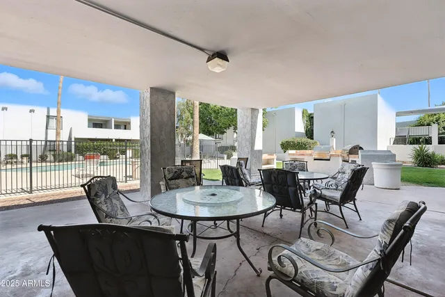 a view of a dining room with furniture window and outside view