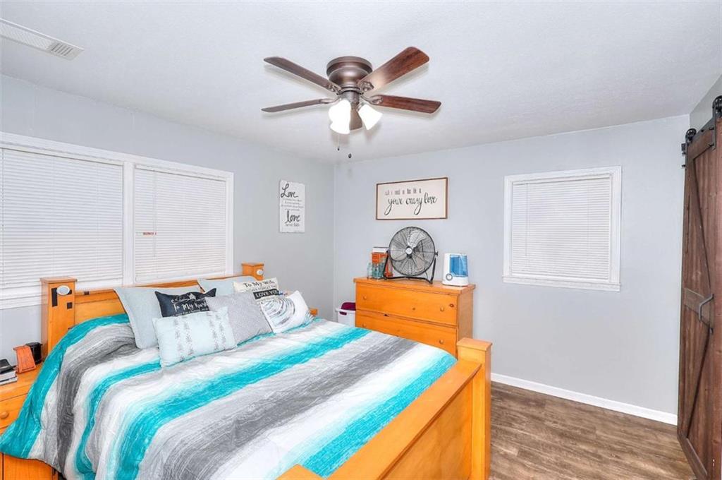 4455 Jersey Walnut Grove Road Covington, GA 30014 - Photo 14 of 28 a bedroom with bed and window