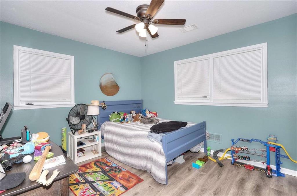 4455 Jersey Walnut Grove Road Covington, GA 30014 - Photo 15 of 28 a bedroom with furniture and a window