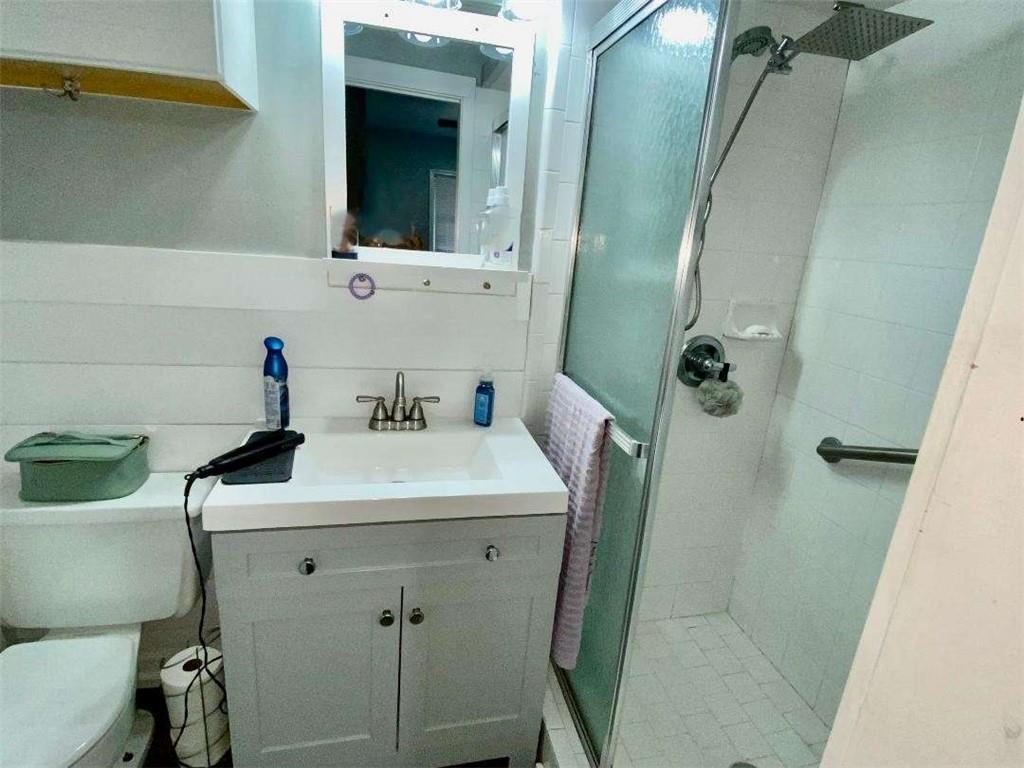 4455 Jersey Walnut Grove Road Covington, GA 30014 - Photo 21 of 28 a bathroom with a sink and mirror with toilet