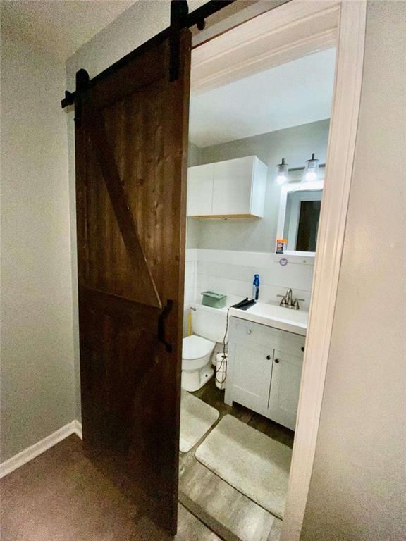 4455 Jersey Walnut Grove Road Covington, GA 30014 - Photo 22 of 28 a bathroom with a sink and a mirror