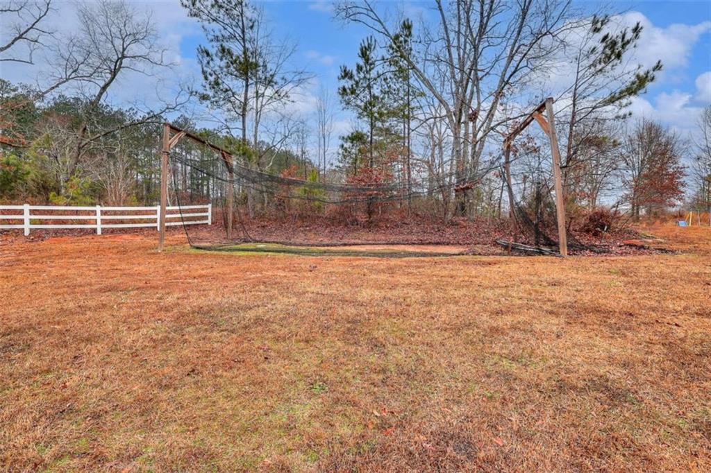 4455 Jersey Walnut Grove Road Covington, GA 30014 - Photo 24 of 28 a view of a yard with trees
