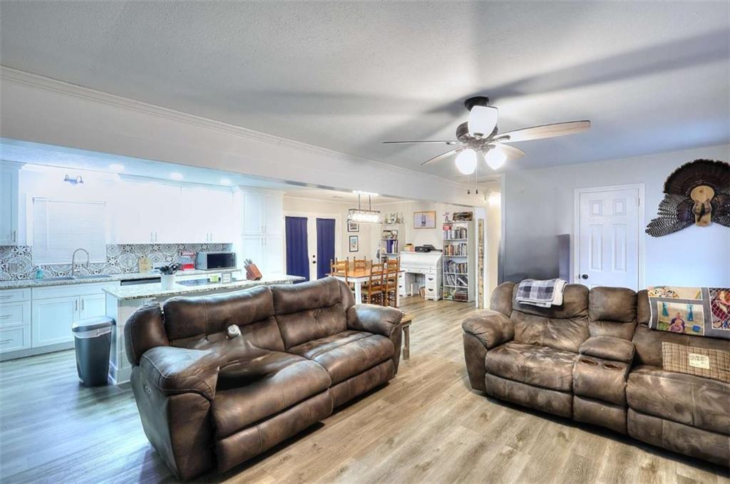 4455 Jersey Walnut Grove Road Covington, GA 30014 - Photo 6 of 28 a living room with furniture and a fireplace