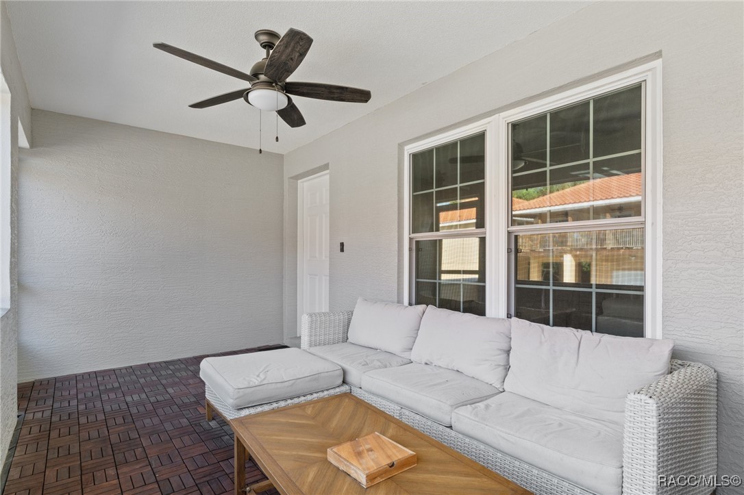 4865 South Tromp Loop Homosassa, FL 34448 - Photo 20 of 30 a living room with furniture and a large window