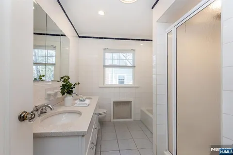 a bathroom with a sink toilet and tub