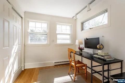 a work room with furniture and windows