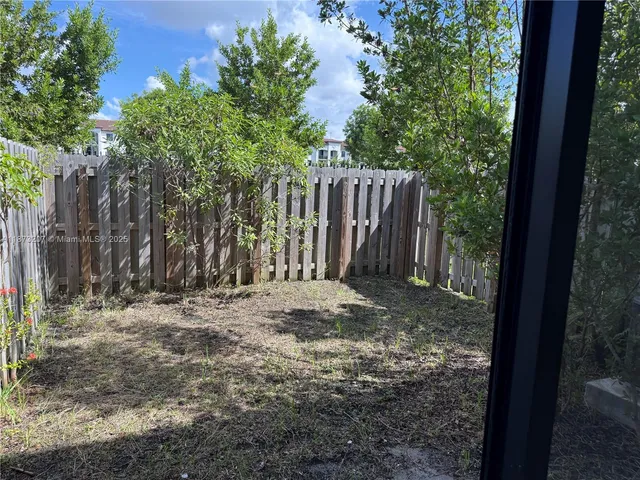 a view of a swimming pool with outdoor seating