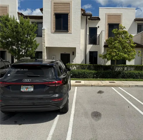 a view of a livingroom with an empty space and a window
