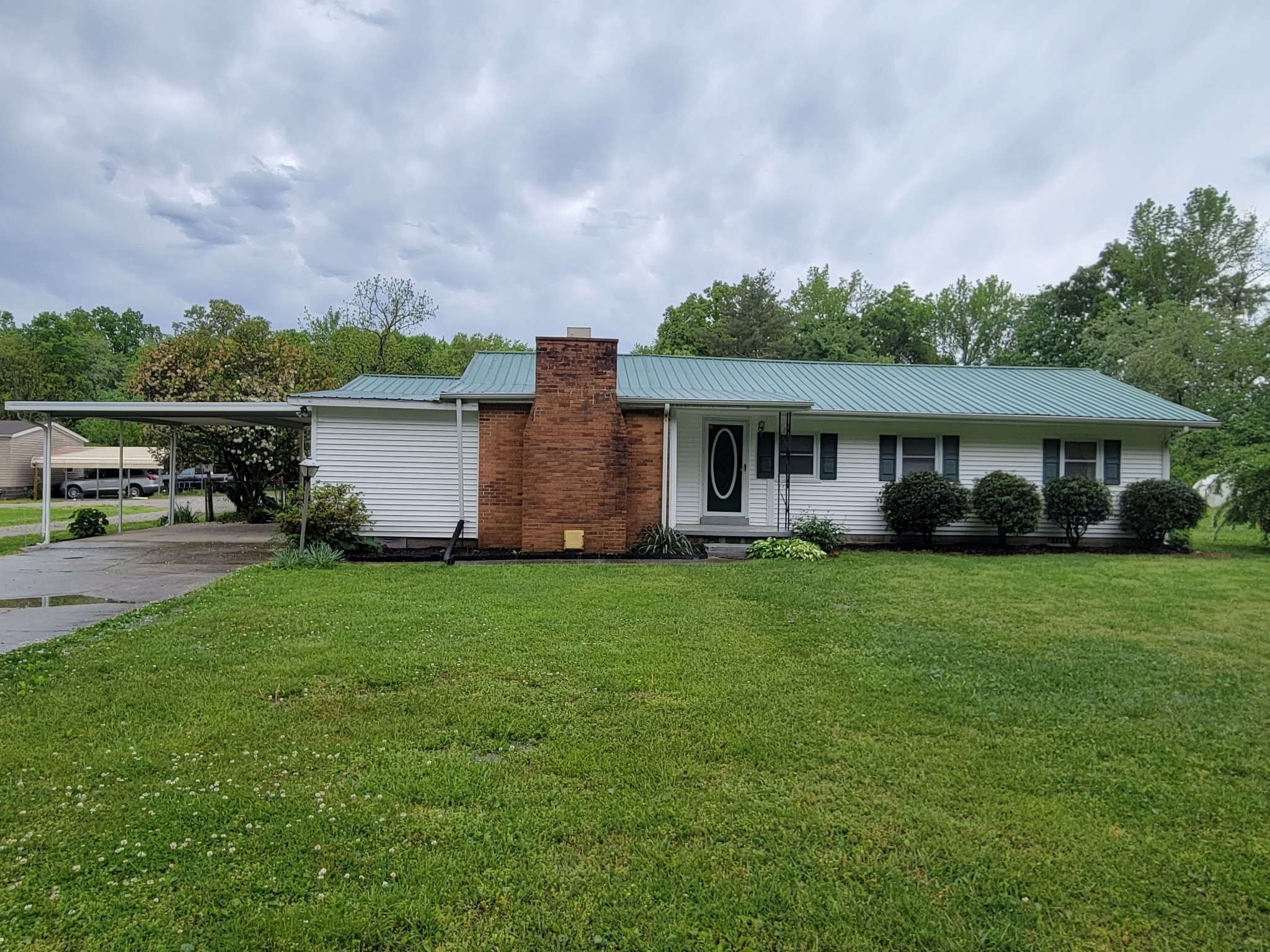132 Gruett Road Manchester, TN 37355 - Photo 1 of 36 a view of a house with backyard and garden