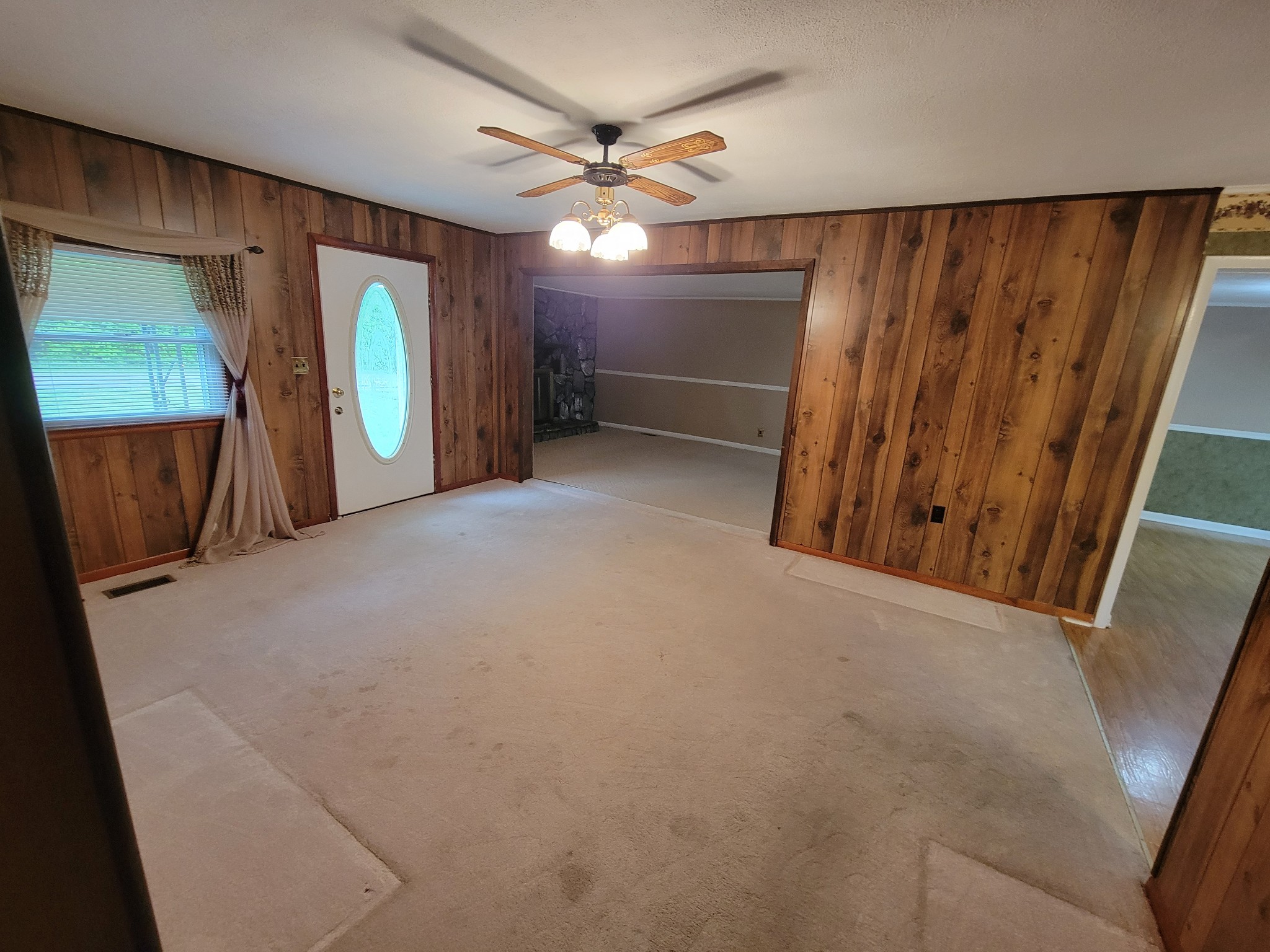 132 Gruett Road Manchester, TN 37355 - Photo 13 of 36 a view of a livingroom with a ceiling fan and wooden floor