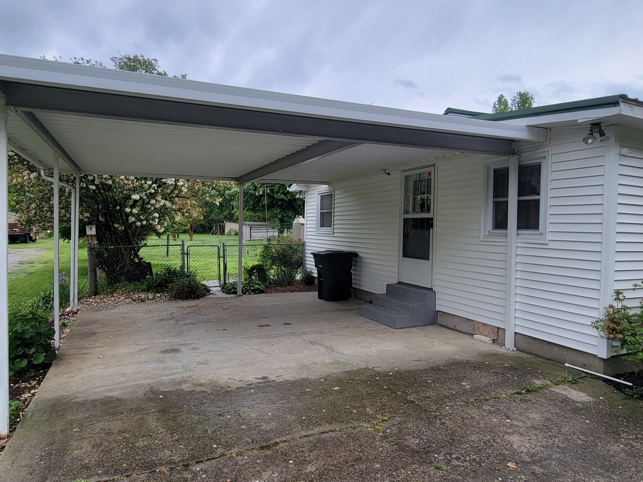 132 Gruett Road Manchester, TN 37355 - Photo 25 of 36 a view of a house with a porch and furniture