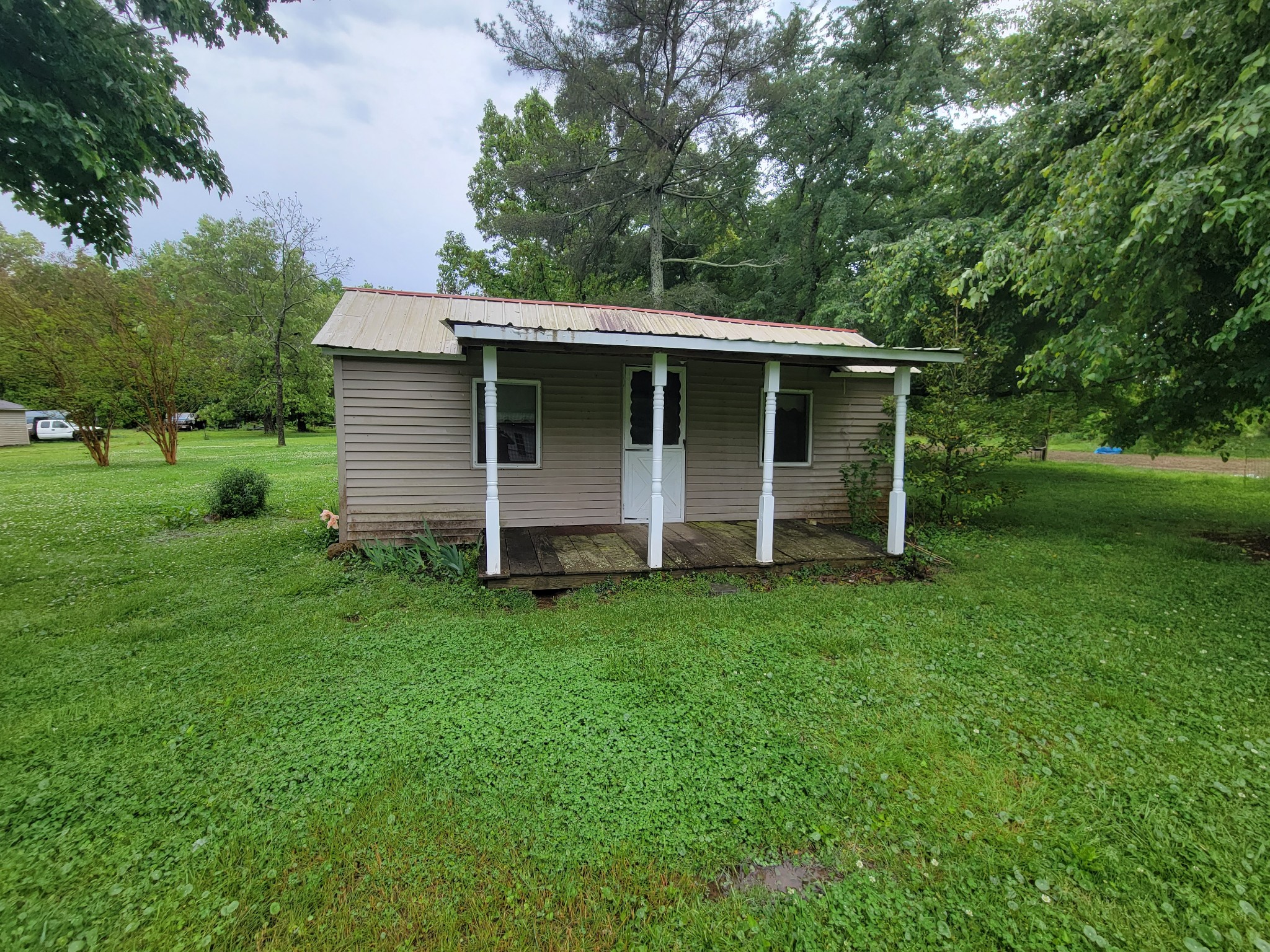 132 Gruett Road Manchester, TN 37355 - Photo 29 of 36 a view of a backyard with barn and large trees