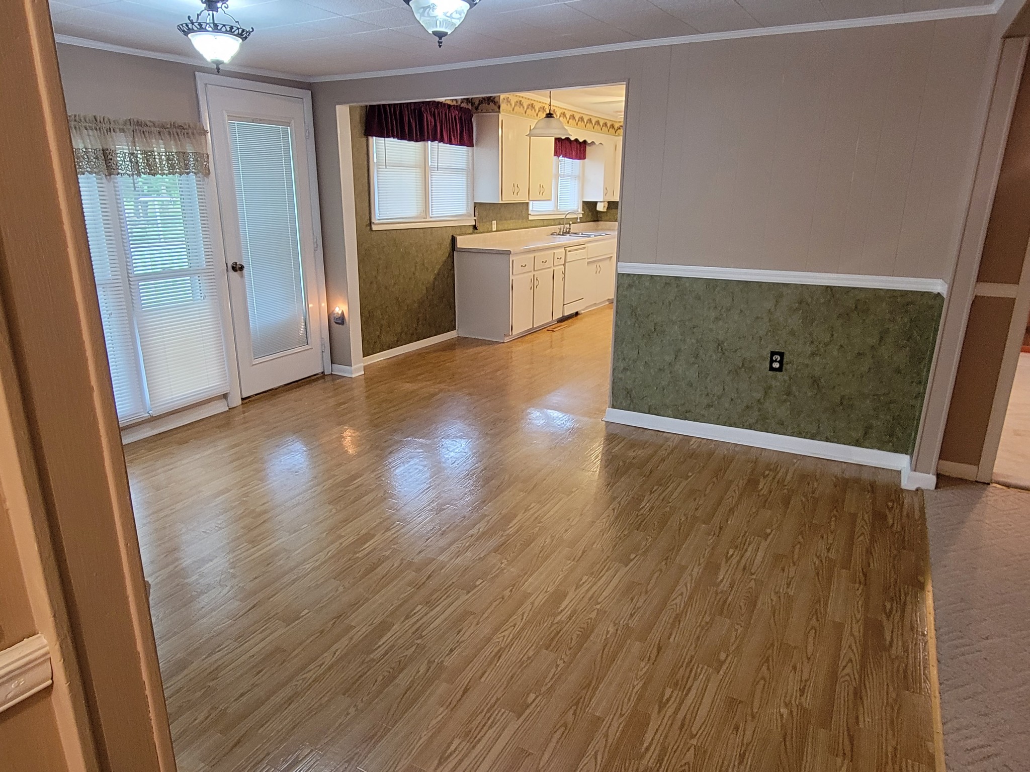 132 Gruett Road Manchester, TN 37355 - Photo 4 of 36 wooden floor in an empty room and a kitchen