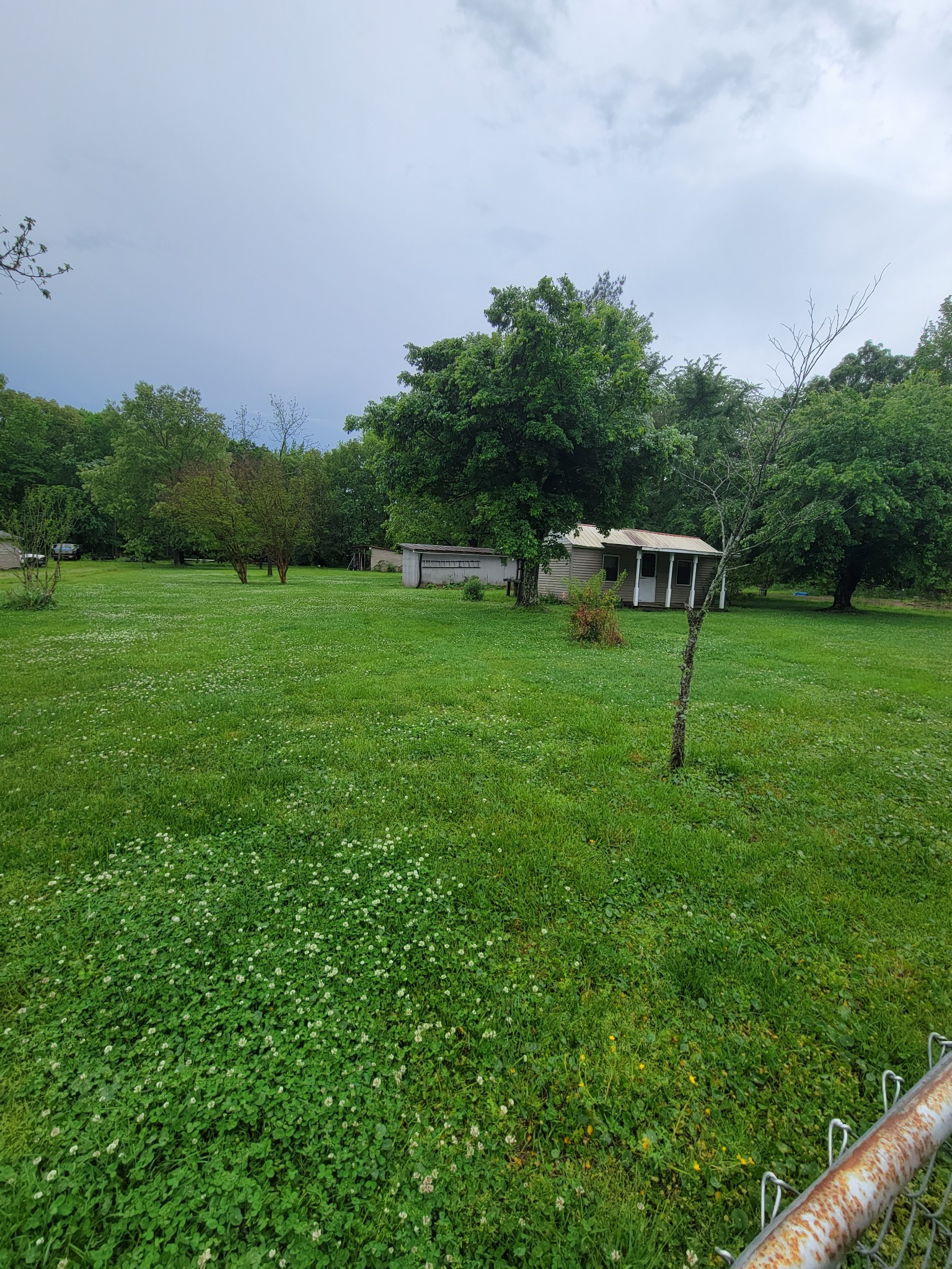 132 Gruett Road Manchester, TN 37355 - Photo 36 of 36 a backyard of a house with lots of green space and garden in the back