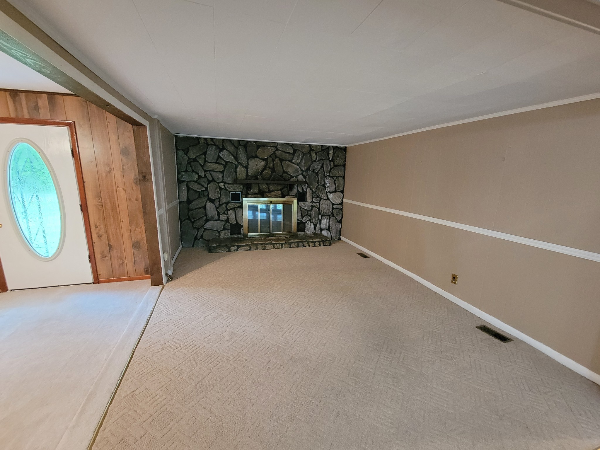132 Gruett Road Manchester, TN 37355 - Photo 7 of 36 an empty room with fireplace and windows