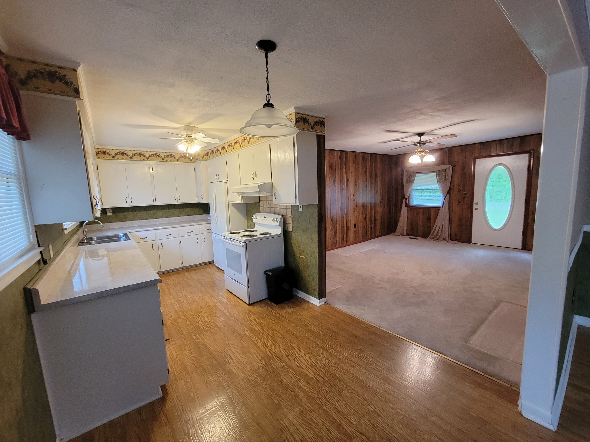 132 Gruett Road Manchester, TN 37355 - Photo 8 of 36 a kitchen with sink refrigerator and microwave