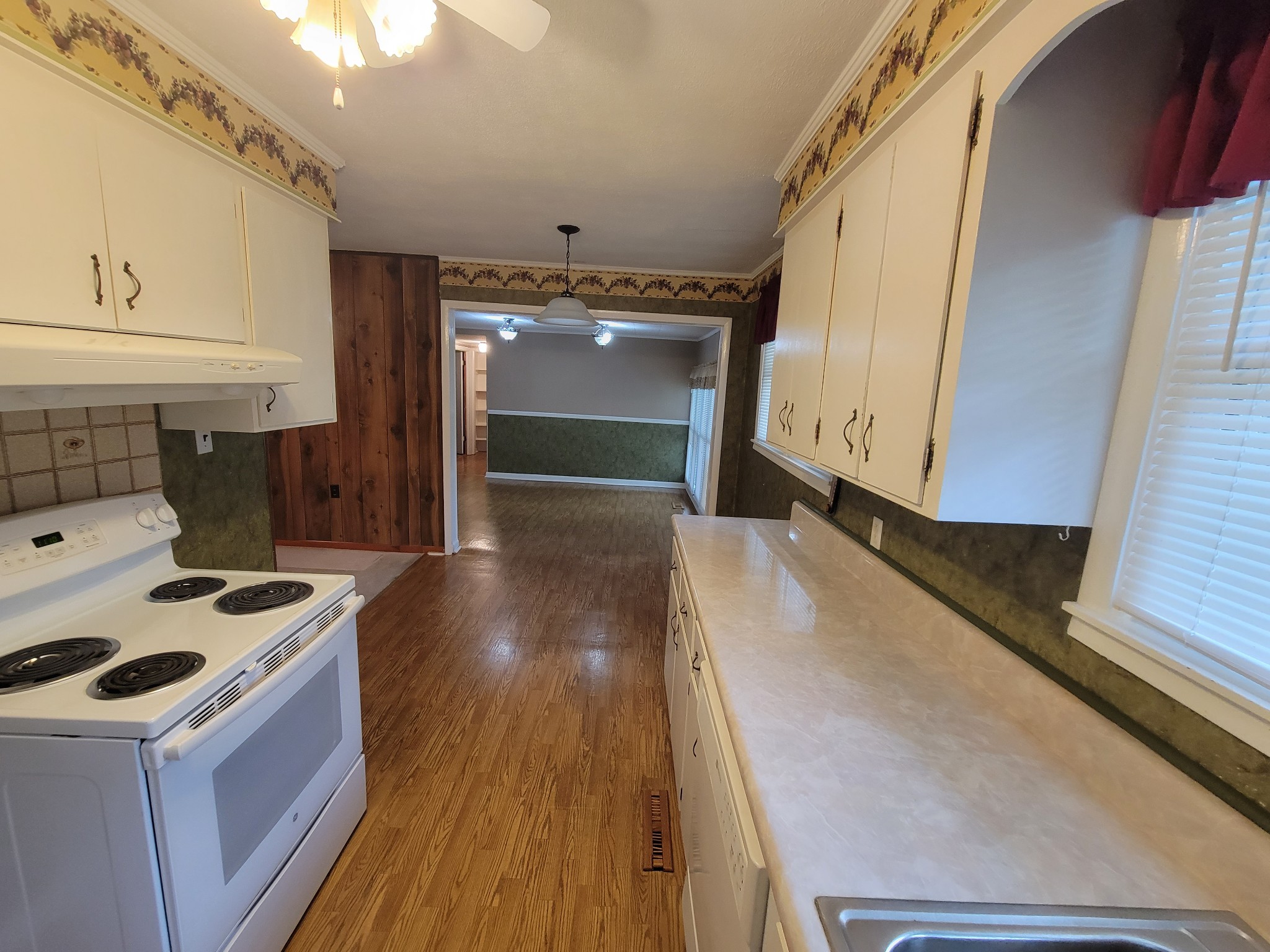 132 Gruett Road Manchester, TN 37355 - Photo 9 of 36 a kitchen with a sink and wooden floor