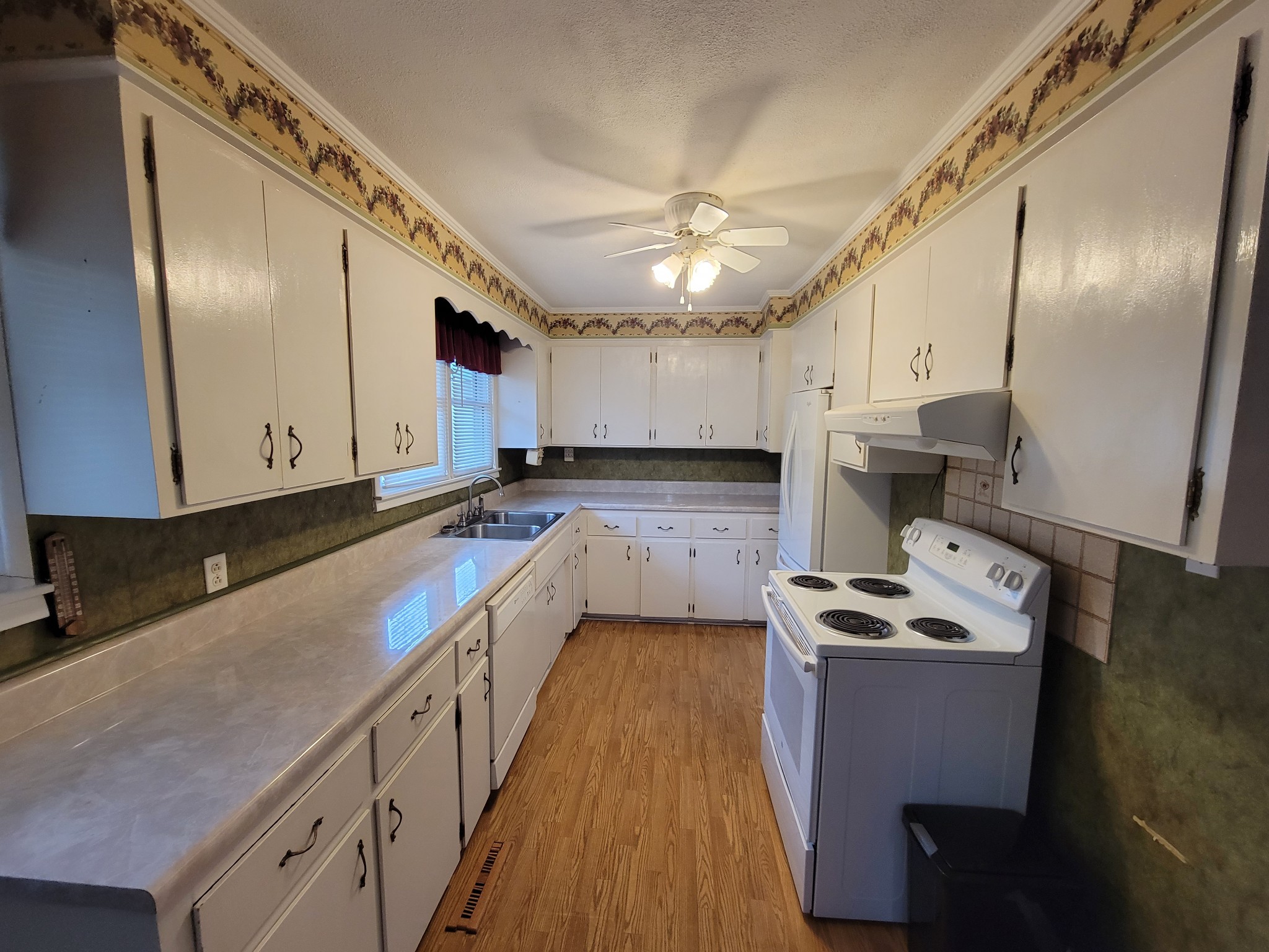 132 Gruett Road Manchester, TN 37355 - Photo 10 of 36 a kitchen with stainless steel appliances granite countertop a sink a stove and a refrigerator