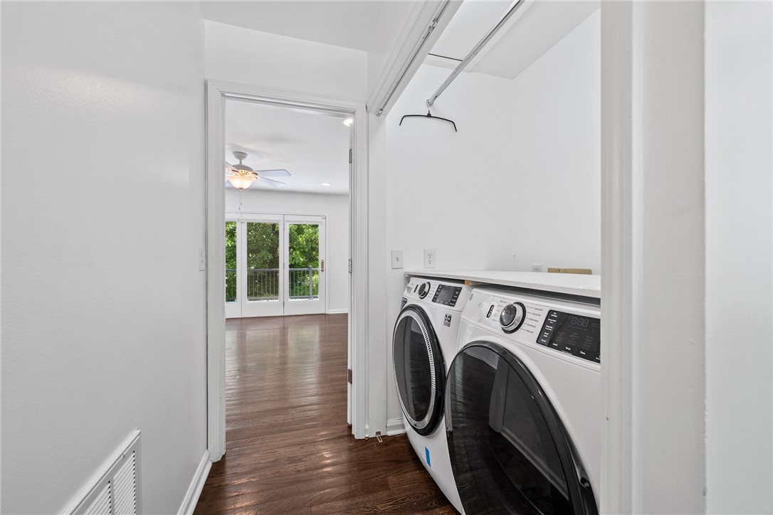 118 Beacon Ridge Circle Salem, SC 29676 - Photo 21 of 45 Functional laundry nook adjacent to an airy living area with balcony access and rich hardwood floors.