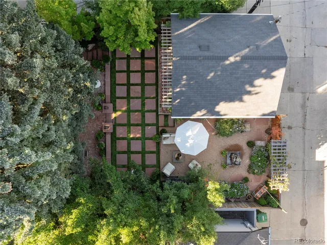 an aerial view of a house with outdoor space
