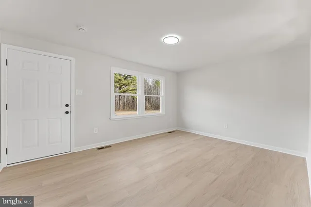 an empty room with windows