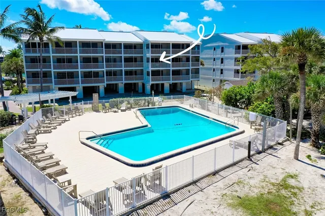 a view of a swimming pool with a patio