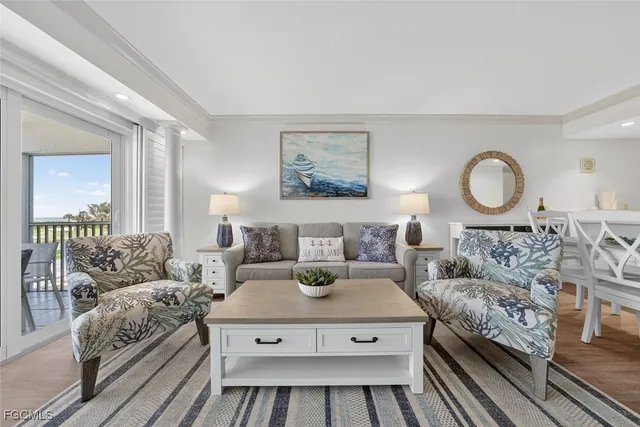 a living room with furniture and a rug