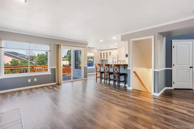 a view of dining room with furniture and wooden floor