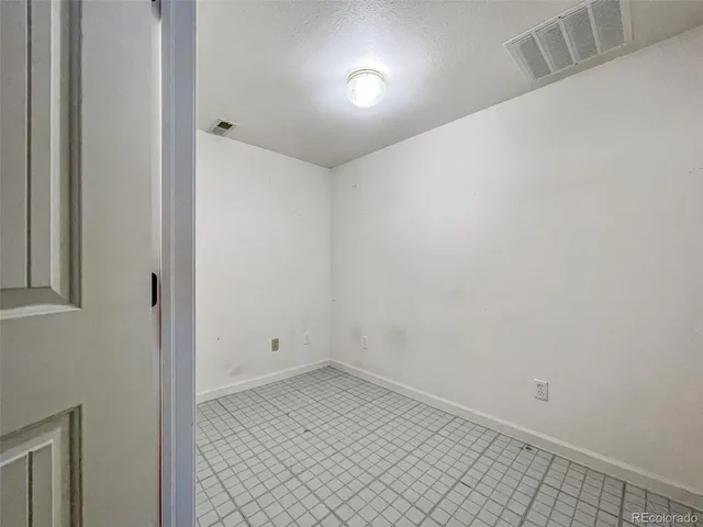 an empty room with an entryway