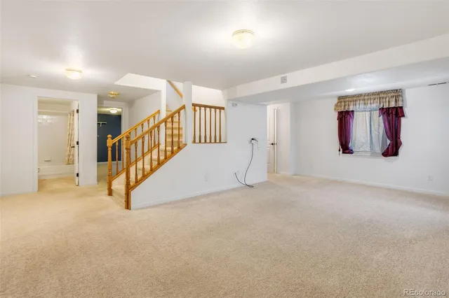 en view interior of a house with stairs and a couch