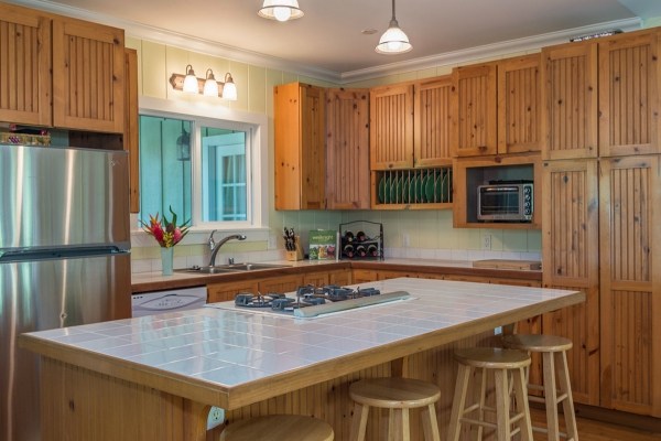 5175 Weke Road Hanalei, HI 96714 - Photo 17 of 25 a kitchen with stainless steel appliances granite countertop a stove a sink and a refrigerator