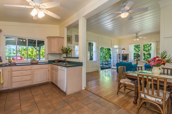 5175 Weke Road Hanalei, HI 96714 - Photo 6 of 25 a kitchen with granite countertop lots of white cabinets stainless steel appliances a counter space and a dining table
